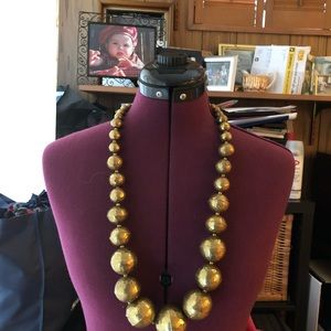 Brass necklace with graduating beads.